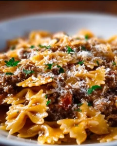 Plate of cheesy beef and bowtie pasta recipe, a comforting dish for dinner