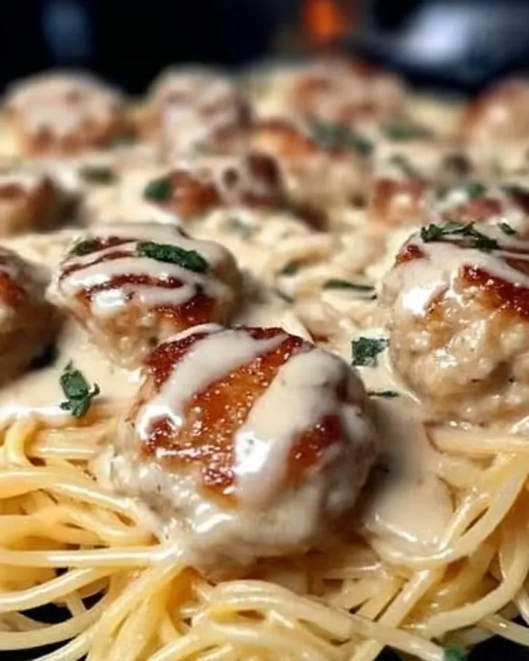 Delicious Garlic Butter Chicken Balls served with creamy pasta